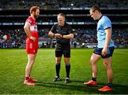 31 March 2024; Referee Conor Lane with team captains Conor Glass of Derry and Con O'Callaghan of Dublin before the Allianz Football League Division 1 Final match between Dublin and Derry at Croke Park in Dublin. Photo by Piaras Ó Mídheach/Sportsfile