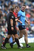 31 March 2024; Brendan Rogers of Derry, left, and Brian Fenton of Dublin in discussion with referee Conor Lane during the Allianz Football League Division 1 Final match between Dublin and Derry at Croke Park in Dublin. Photo by John Sheridan/Sportsfile