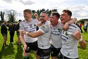31 March 2024; Warwickshire players, from left, Paddy Hands, Oisín Slattery, David Devine and Dan Lowry celebrate after their side's victory in the Allianz Hurling League Division 3B Final match between Fermanagh and Warwickshire at St Joseph's Park in Ederney, Fermanagh. Photo by Sam Barnes/Sportsfile