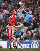31 March 2024; Brian Fenton of Dublin in action against Conor Glass of Derry during the Allianz Football League Division 1 Final match between Dublin and Derry at Croke Park in Dublin. Photo by Ramsey Cardy/Sportsfile