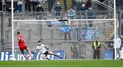 31 March 2024; Dublin goalkeeper Evan Comerford is beaten for Derry's first goal, a penalty scored by Shane McGuigan of Derry, during the Allianz Football League Division 1 Final match between Dublin and Derry at Croke Park in Dublin. Photo by Piaras Ó Mídheach/Sportsfile