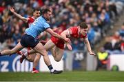 31 March 2024; Ethan Doherty of Derry is fouled by Seán MacMahon of Dublin, resulting in a Derry penalty, during the Allianz Football League Division 1 Final match between Dublin and Derry at Croke Park in Dublin. Photo by Ramsey Cardy/Sportsfile