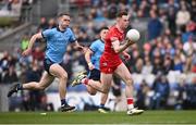 31 March 2024; Eoin McEvoy of Derry gets away from Brian Fenton of Dublin on his way to scoring his side's second goal during the Allianz Football League Division 1 Final match between Dublin and Derry at Croke Park in Dublin. Photo by Ramsey Cardy/Sportsfile
