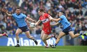 31 March 2024; Ethan Doherty of Derry in action against Dublin players, Eoin Murchan right, and Seán MacMahon during the Allianz Football League Division 1 Final match between Dublin and Derry at Croke Park in Dublin. Photo by John Sheridan/Sportsfile