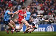 31 March 2024; Ethan Doherty of Derry shoots under pressure from Dublin goalkeeper Evan Comerford and Cian Murphy, left., during the Allianz Football League Division 1 Final match between Dublin and Derry at Croke Park in Dublin. Photo by Ramsey Cardy/Sportsfile