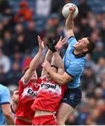31 March 2024; Con O'Callaghan of Dublin in action against Lachlan Murray, left, and Niall Toner of Derry during the Allianz Football League Division 1 Final match between Dublin and Derry at Croke Park in Dublin. Photo by Ramsey Cardy/Sportsfile