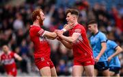 31 March 2024; Eoin McEvoy of Derry celebrates with Conor Glass, left, after scoring their side's third goal during the Allianz Football League Division 1 Final match between Dublin and Derry at Croke Park in Dublin. Photo by Ramsey Cardy/Sportsfile