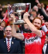 31 March 2024; Derry captain Conor Glass lifts the trophy after the Allianz Football League Division 1 Final match between Dublin and Derry at Croke Park in Dublin. Photo by Ramsey Cardy/Sportsfile