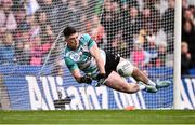 31 March 2024; Derry goalkeeper Odhran Lynch saves a penalty from Lorcan O'Dell of Dublin during a penalty shoot-out inthe Allianz Football League Division 1 Final match between Dublin and Derry at Croke Park in Dublin. Photo by Ramsey Cardy/Sportsfile