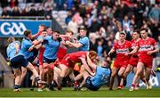 31 March 2024; Players from both teams, including Conor Glass of Derry, and Paddy Small of Dublin, tussle during the Allianz Football League Division 1 Final match between Dublin and Derry at Croke Park in Dublin. Photo by Ramsey Cardy/Sportsfile