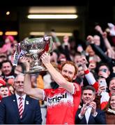 31 March 2024; Derry captain Conor Glass lifts the cup after his side's victory in the Allianz Football League Division 1 Final match between Dublin and Derry at Croke Park in Dublin. Photo by Piaras Ó Mídheach/Sportsfile