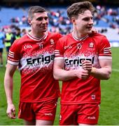 31 March 2024; Derry players Ciarán McFaul, left, and Ethan Doherty celebrate after their side's victory in the Allianz Football League Division 1 Final match between Dublin and Derry at Croke Park in Dublin. Photo by Piaras Ó Mídheach/Sportsfile