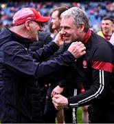 31 March 2024; Derry manager Mickey Harte, left, celebrates with selector Gavin Devlin after their side's penalty shoot-out victory in the Allianz Football League Division 1 Final match between Dublin and Derry at Croke Park in Dublin. Photo by Piaras Ó Mídheach/Sportsfile