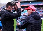 31 March 2024; Derry goalkeeper Odhran Lynch, centre, celebrates with team-mate Christopher McKaigue, left, and manager Mickey Harte after their side's victory in the penalty shoot-out of the Allianz Football League Division 1 Final match between Dublin and Derry at Croke Park in Dublin. Photo by Piaras Ó Mídheach/Sportsfile