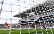 31 March 2024; Conor Glass of Derry scores a penalty past Dublin goalkeeper Evan Comerford during the penalty shoot-out in the Allianz Football League Division 1 Final match between Dublin and Derry at Croke Park in Dublin. Photo by Ramsey Cardy/Sportsfile
