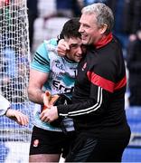 31 March 2024; Derry goalkeeper Odhran Lynch celebrates with Derry selector Gavin Devlin after their side's victory in the penalty shoot-out of the Allianz Football League Division 1 Final match between Dublin and Derry at Croke Park in Dublin. Photo by Piaras Ó Mídheach/Sportsfile