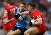 31 March 2024; Cormac Murphy of Derry in action against Cian O'Connor of Dublin during the Allianz Football League Division 1 Final match between Dublin and Derry at Croke Park in Dublin. Photo by John Sheridan/Sportsfile