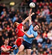31 March 2024; Conor Glass of Derry and Brian Fenton of Dublin during the Allianz Football League Division 1 Final match between Dublin and Derry at Croke Park in Dublin. Photo by Ramsey Cardy/Sportsfile