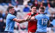31 March 2024; Conor McCluskey of Derry tussles with Brian Howard, left, and John Small during the Allianz Football League Division 1 Final match between Dublin and Derry at Croke Park in Dublin. Photo by Piaras Ó Mídheach/Sportsfile