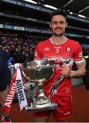 31 March 2024; Christopher McKaigue of Derry with the trophy after the Allianz Football League Division 1 Final match between Dublin and Derry at Croke Park in Dublin. Photo by Ramsey Cardy/Sportsfile