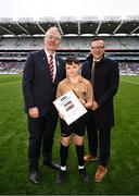31 March 2024; Cruz Atkinson and Cillian Hanrahan, referees of the Cumann na mBunscol halftime games, were honoured on behalf of their whole team for their joint contributions this year and were recognised by  at half time of Sunday’s Allianz Football League Division 1 Final between Dublin and Derry. Pictured is Cruz Atkinson, with Uachtarán Chumann Lúthchleas Gael Jarlath Burns and Mark Brennan, Head of Market Management at Allianz Insurance. Photo by Ramsey Cardy/Sportsfile