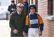 31 March 2024; Clerk of the course Brendan Sheridan, left, and jockey Phillip Enright before the Cawley Furniture Novice Handicap Hurdle on day two of the Fairyhouse Easter Festival at Fairyhouse Racecourse in Ratoath, Meath. Photo by Seb Daly/Sportsfile