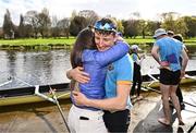 30 March 2024; Dach Murray of UCD Senior Men celebrates with supporters after winning the annual Colours Boat Race between UCD and Trinity College on the River Liffey in Dublin. Photo by Sam Barnes/Sportsfile