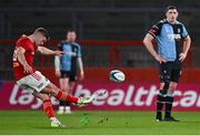 30 March 2024; Jack Crowley of Munster kicks a penalty to make it 3-0 during the United Rugby Championship match between Munster and Cardiff at Thomond Park in Limerick. Photo by Brendan Moran/Sportsfile