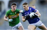 30 March 2024; Evan O'Carroll of Laois in action against Mark Diffley of Leitrim during the Allianz Football League Division 4 final match between Laois and Leitrim at Croke Park in Dublin. Photo by Shauna Clinton/Sportsfile