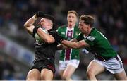 30 March 2024; Daniel Guinness of Down is tackled by Jonathan Lynam of Westmeath during the Allianz Football League Division 3 final match between Down and Westmeath at Croke Park in Dublin. Photo by Shauna Clinton/Sportsfile