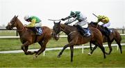 1 April 2024; Implicit, centre, with Paul Townend up, on their way to winning the Farmhouse Foods Novice Handicap Hurdle, from eventual second place Ossie's Lodge, left, with Philip Enright up, on day three of the Fairyhouse Easter Festival at Fairyhouse Racecourse in Ratoath, Meath. Photo by Seb Daly/Sportsfile