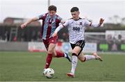 1 April 2024; Ryan O'Kane of Dundalk in action against Killian Cailloce of Drogheda United during the SSE Airtricity Men's Premier Division match between Dundalk and Drogheda United at Oriel Park in Dundalk, Louth. Photo by Ben McShane/Sportsfile