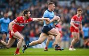 31 March 2024; John Small of Dublin in action against Niall Loughlin of Derry during the Allianz Football League Division 1 Final match between Dublin and Derry at Croke Park in Dublin. Photo by Ramsey Cardy/Sportsfile