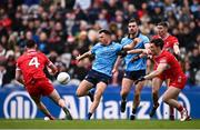 31 March 2024; Colm Basquel of Dublin in action against Diarmuid Baker, left, and Conor McCluskey of Derry during the Allianz Football League Division 1 Final match between Dublin and Derry at Croke Park in Dublin. Photo by Ramsey Cardy/Sportsfile