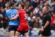 31 March 2024; Brian Fenton of Dublin and Brendan Rogers of Derry with referee Conor Lane during the Allianz Football League Division 1 Final match between Dublin and Derry at Croke Park in Dublin. Photo by Ramsey Cardy/Sportsfile