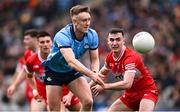31 March 2024; Tom Lahiff of Dublin in action against Diarmuid Baker of Derry during the Allianz Football League Division 1 Final match between Dublin and Derry at Croke Park in Dublin. Photo by Ramsey Cardy/Sportsfile