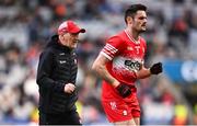 31 March 2024; Derry manager Mickey Harte, left, and Christopher McKaigue of Derry during the Allianz Football League Division 1 Final match between Dublin and Derry at Croke Park in Dublin. Photo by Ramsey Cardy/Sportsfile