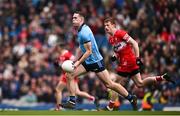 31 March 2024; Brian Fenton of Dublin in action against Brendan Rogers of Derry during the Allianz Football League Division 1 Final match between Dublin and Derry at Croke Park in Dublin. Photo by Ramsey Cardy/Sportsfile