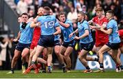 31 March 2024; Conor Glass of Derry and Paddy Small of Dublin tussle during the Allianz Football League Division 1 Final match between Dublin and Derry at Croke Park in Dublin. Photo by Ramsey Cardy/Sportsfile