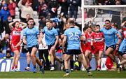 31 March 2024; Dublin players, including Theo Clancy, left, celebrate their side's second goal, scored by Greg McEneaney, during the Allianz Football League Division 1 Final match between Dublin and Derry at Croke Park in Dublin. Photo by Ramsey Cardy/Sportsfile