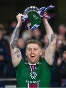 30 March 2024; Luke Loughlin of Westmeath lifts the trophy after winning the Allianz Football League Division 3 final match between Down and Westmeath at Croke Park in Dublin. Photo by Ramsey Cardy/Sportsfile