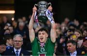 30 March 2024; Matthew Whittaker of Westmeath lifts the trophy after winning the Allianz Football League Division 3 final match between Down and Westmeath at Croke Park in Dublin. Photo by Ramsey Cardy/Sportsfile