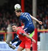 1 April 2024; Cameron McJannet of Derry City in action against John O'Sullivan of Shelbourne during the SSE Airtricity Men's Premier Division match between Shelbourne and Derry City at Tolka Park in Dublin. Photo by Stephen McCarthy/Sportsfile