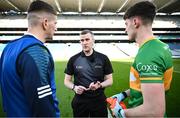 30 March 2024; Referee Thomas Murphy with team captains Evan O'Carroll of Laois and Mark Diffley of Leitrim before the Allianz Football League Division 4 final match between Laois and Leitrim at Croke Park in Dublin. Photo by Ramsey Cardy/Sportsfile