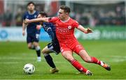 1 April 2024; Evan Caffrey of Shelbourne in action against Paul McMullan of Derry City during the SSE Airtricity Men's Premier Division match between Shelbourne and Derry City at Tolka Park in Dublin. Photo by Stephen McCarthy/Sportsfile