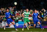 1 April 2024; Aaron Greene of Shamrock Rovers in action against Grant Horton, left, and Darragh Power of Waterford during the SSE Airtricity Men's Premier Division match between Waterford and Shamrock Rovers at the Regional Sports Centre in Waterford. Photo by Tyler Miller/Sportsfile