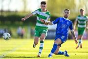 1 April 2024; Darragh Burns of Shamrock Rovers is tackled by Robbie McCourt of Waterford during the SSE Airtricity Men's Premier Division match between Waterford and Shamrock Rovers at the Regional Sports Centre in Waterford. Photo by Tyler Miller/Sportsfile