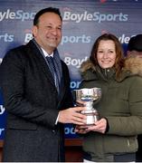 1 April 2024; Wife of winning trainer Heidi Gibney is presented with her trophy by An Taoiseach Leo Varadkar TD after sending out Intense Raffles to win the BoyleSports Irish Grand National Steeplechase  on day three of the Fairyhouse Easter Festival at Fairyhouse Racecourse in Ratoath, Meath. Photo by Seb Daly/Sportsfile