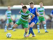 1 April 2024; Darragh Burns of Shamrock Rovers in action against Darragh Power of Waterford during the SSE Airtricity Men's Premier Division match between Waterford and Shamrock Rovers at the Regional Sports Centre in Waterford. Photo by Tyler Miller/Sportsfile