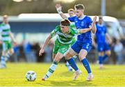 1 April 2024; Darragh Burns of Shamrock Rovers in action against Darragh Power of Waterford during the SSE Airtricity Men's Premier Division match between Waterford and Shamrock Rovers at the Regional Sports Centre in Waterford. Photo by Tyler Miller/Sportsfile